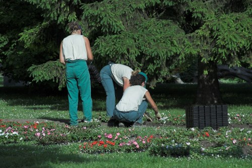 First aider and emergency kit on-site during hedge trimming operations